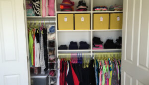 Picture of a well organized kid closet to show kid friendly closet organication.